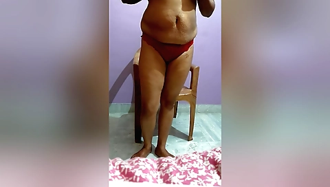 Solo female naked in a bikini with a red lingerie under it