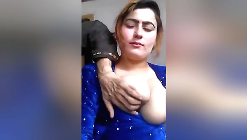 Amateur brunette with huge boobs shows off her curves