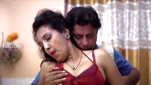 Busty brunette in a black dress and stockings rides a big dick