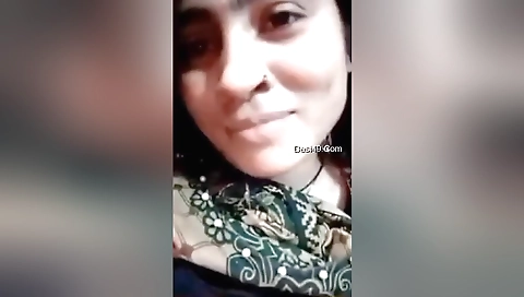 Busty brunette shows her big boobs and tits in a shower