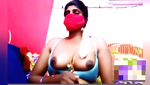 Busty brunette masturbates in the bedroom in an amateur video