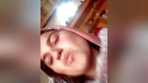 Amateur brunette with big boobs and small tits in a bed