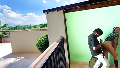 Brunette girl in an indian outfit fucks on the balcony